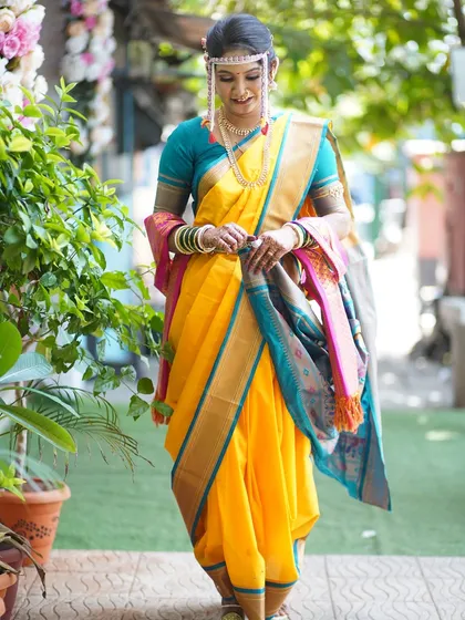 A full-length shot of the bride, capturing the elegance of her posture and the beauty of her traditional attire.