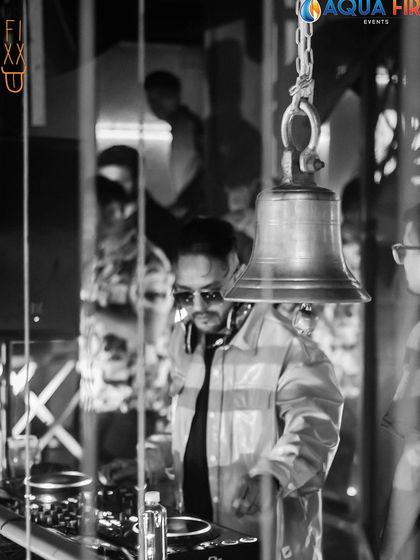 A black and white shot capturing me at work at The Fixx. Sometimes the most intense moments are the quietest ones behind the console.