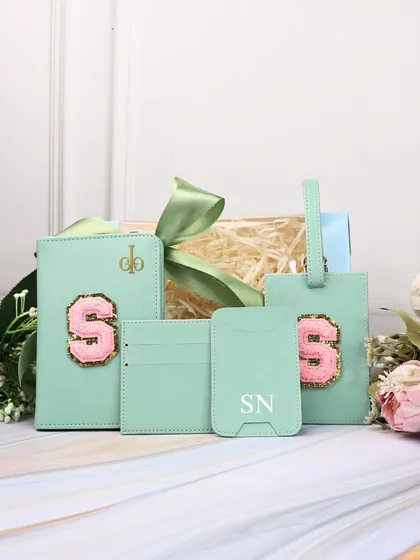A mint green travel combo set, personalized with a pink "S" chenille patch. A great color combination for a stylish gift.