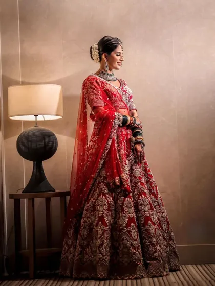 A full-length shot of the bride looking absolutely radiant. Her subtle glam makeup enhances her natural beauty, creating a timeless and unforgettable look.