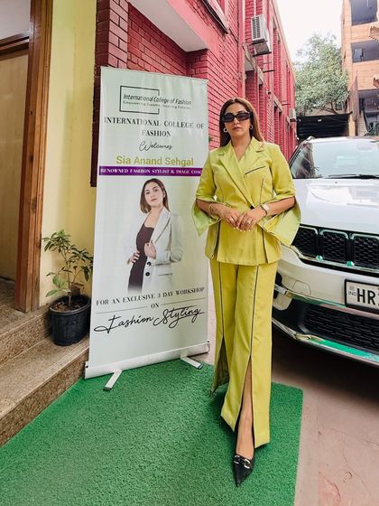Co-ords are cute, but co-ords with creative construction are a whole new level. Standing by my workshop banner at the International College of Fashion in this custom-tailored lime green suit.