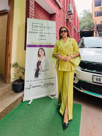 Posing next to the welcome banner for my 3-day exclusive workshop on fashion styling. It's always a pleasure to share my knowledge and passion with aspiring fashion professionals.