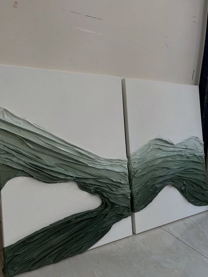 The complete diptych of the green fabric texture artwork. Placing the two canvases together creates a continuous flow, like rolling hills or gentle waves.