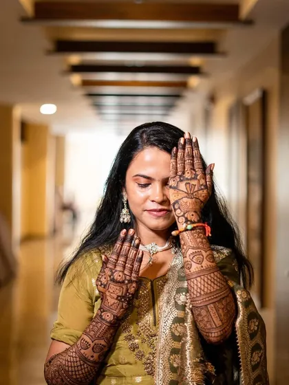 A beautiful shot of a bride with her full bridal mehendi. Sweet moments wrapped in henna.