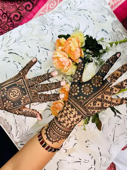 Another angle of the contrasting traditional designs, showing how different patterns can work together to create a unique and personalized look for a client.