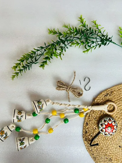 Here are all the inclusions for our 'Symphony Chimes'. Each set comes with a bunch of four ceramic bell chimes, a ceramic wall hook, and a mini installation kit to help you hang it easily.