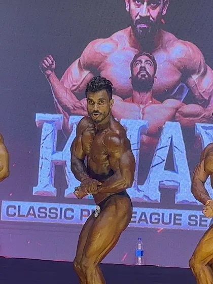 The classic physique category demands both size and aesthetics. Here, my athletes demonstrate the side chest pose, highlighting pectoral thickness, arm development, and striated deltoids. Every pose is a battle, and we come prepared to win.