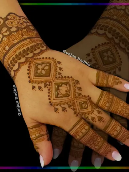A modern design with geometric floral blocks. This is a unique and stylish take on traditional mehendi patterns.