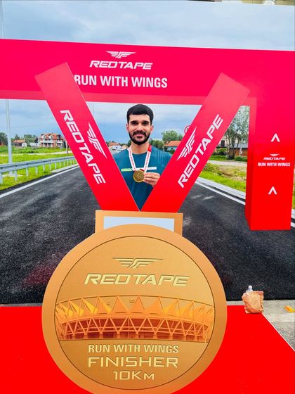 Proudly holding my finisher's medal. Every achievement, big or small, is a step forward on the fitness journey.