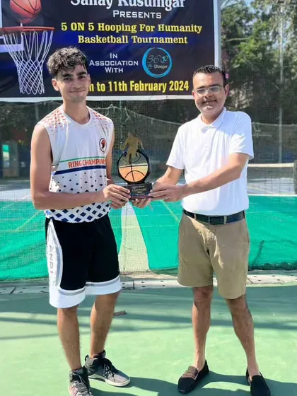 An MVP receiving his award from the event organizer. We ensure every achievement is recognized with a formal presentation.