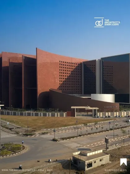 An aerial view of the Surat Diamond Bourse shows its impressive scale and strategic layout. The building's form is a direct response to the climate, designed to unify the diamond community in a sustainable, high-performance environment.