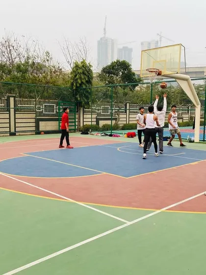 Players battle for a rebound under the hoop.