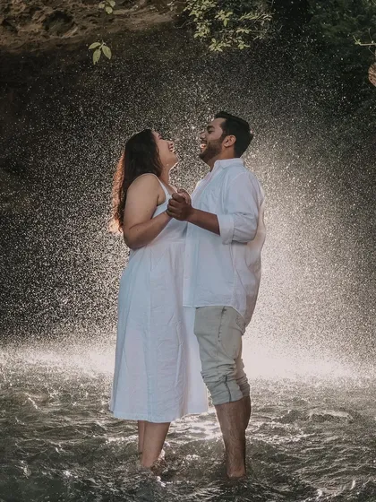 Love should be playful and full of laughter. For our pre-wedding shoots, we find beautiful natural settings like this waterfall, creating a space for you to just be yourselves while we capture your genuine connection.