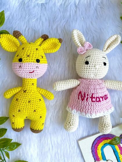 A classic duo, the giraffe and the bunny! This bunny is personalized with the name "Nitaya" on her pink dress. These make a wonderful gift set for a new baby.