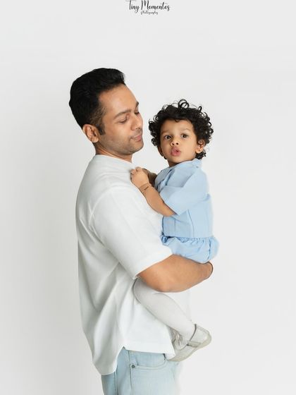 A quiet, loving gaze between a father and his little girl. This portrait captures the gentle side of their relationship, a cherished memory for years to come.