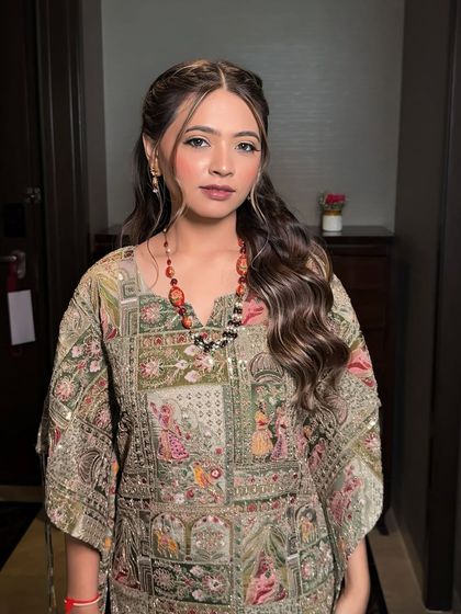 A full shot of the bride in her beautiful printed Mehendi outfit. The natural makeup look allows her personality and the outfit to be the main focus.