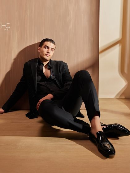 This relaxed pose shows the modern attitude of my cocktail wear. The all-black ensemble is elevated by the unique textures and sharp tailoring of the jacket.