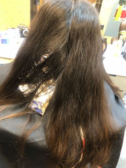 This image shows the balayage process in action, with foils strategically placed to isolate sections for coloring. I then created a gold chocolate balayage and finished with a Botox treatment for ultra-shiny, manageable hair.