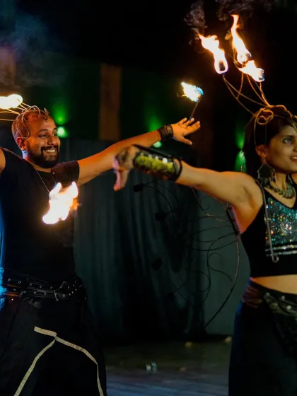 Performing with my partner Yacobeh as part of our duo act. We bring a synchronized energy to our fire shows, making them perfect for weddings and corporate events that need a coordinated, high-impact performance.