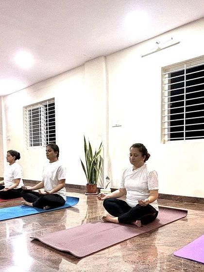 A moment of collective calm as the class sits in meditation. We dedicate time in every session to quiet the mind and connect with the breath.