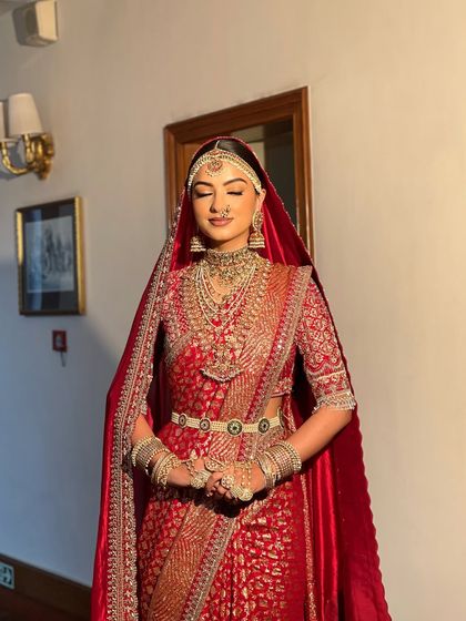 A serene portrait of the South Indian bride. The traditional sleek bun with matha patti is a core part of my skill set, ensuring authenticity and grace for such important cultural ceremonies.