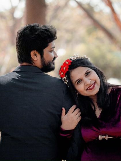 A sweet and romantic pose of a couple during their outdoor maternity shoot. This candid-style shot captures the connection and excitement between the parents-to-be.