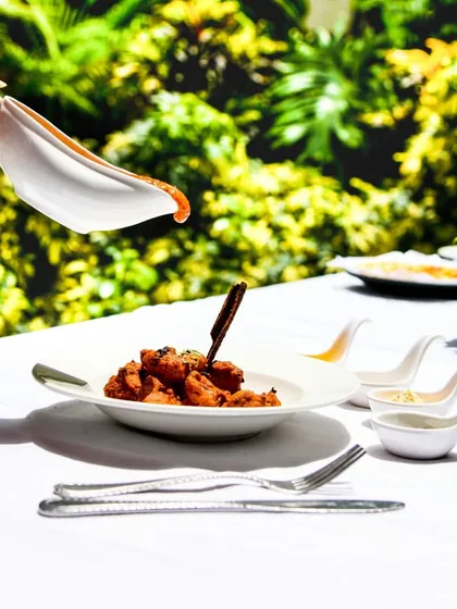 Our Chicken Makhani Dhunvedar is infused with a smoky flavor, elevating the classic butter chicken. Tender chicken in a rich, creamy tomato gravy makes for a satisfying meal.