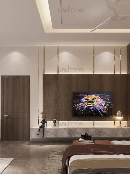 This luxurious bedroom features a stunning marble feature wall, quilted textures, and plush upholstered furniture. The warm tones, abstract art, and bespoke shelving create a space for those who value refinement.