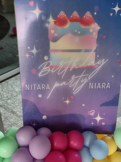 A personalized welcome sign for Nitara and Niara's birthday party. We design custom signage with themed graphics and balloon accents to greet guests and set the tone for the celebration right from the entrance.