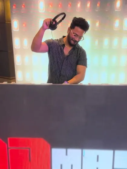 Here I am in my element at a wedding gig. Behind the console, my focus is on reading the room and seamlessly blending tracks to create a non-stop dance party for you and your guests.