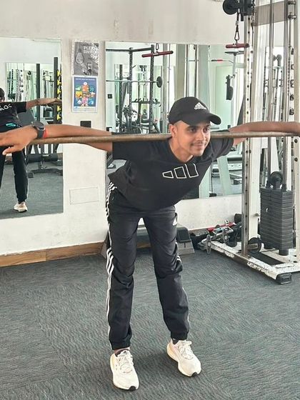 A close-up of the good morning stretch, focusing on hinging at the hips to activate the posterior chain.