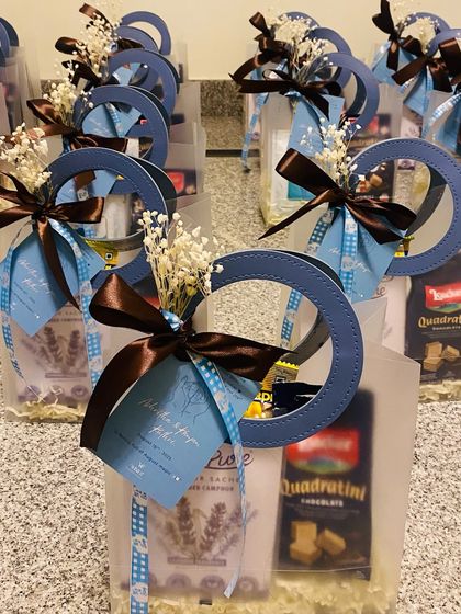 A row of beautifully assembled newborn announcement favors, ready to be given to friends and family to share the joyous news.