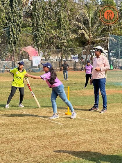 A woman bowls with focus during a Parents Premier League match. We create a supportive space for women to participate and compete in our tennis ball cricket tournaments.