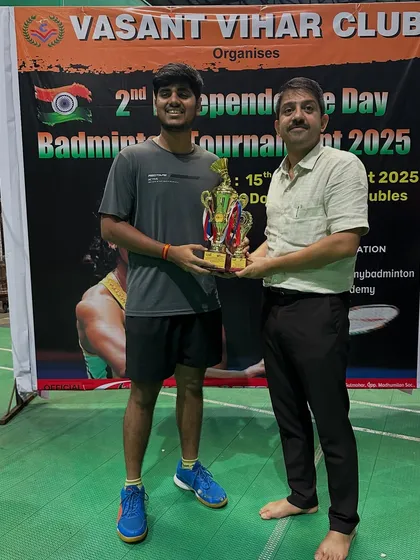 A C-Group Men's Doubles winner, Mandar, celebrating his victory.