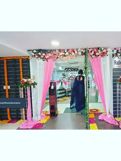 Here’s how we transform a corporate office entrance for a festival. For Radware India, we used bright pink and white fabric drapes, floral pillars, and a traditional flower path to create a welcoming and celebratory atmosphere for employees and visitors.