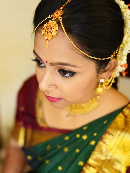 A close up showcasing the flawless eye makeup. I used a classic winged liner and subtle shimmer to make her eyes pop.