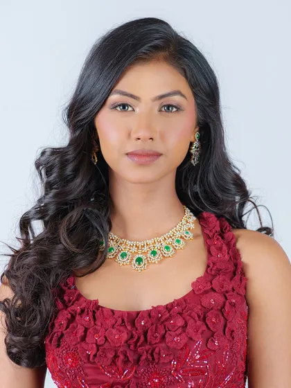 A classic editorial look with soft, open waves. This simple yet elegant hairstyle perfectly complements the model's features and the statement jewelry.