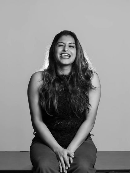 Capturing a moment of genuine laughter in the studio. Black and white helps to emphasize the emotion of the moment.