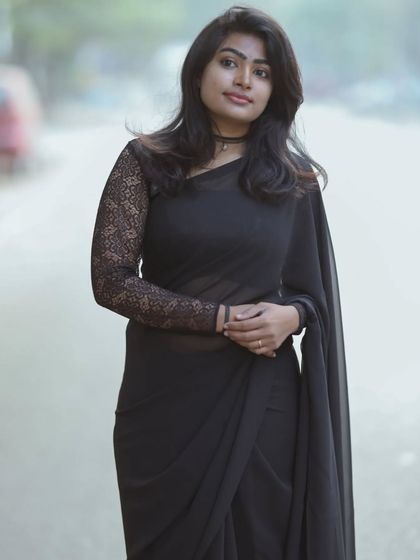 A duplicate of the full-length black saree shot.
