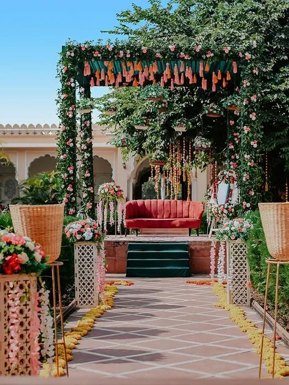 A view of the main stage and seating area for an outdoor mehendi. This shot captures the overall vibe and aesthetic of the event decor.