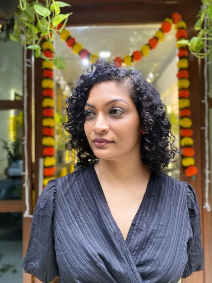 More examples of my short curly haircuts, from bobs to layered chops, each one personalized to the client's curl pattern and face shape.
