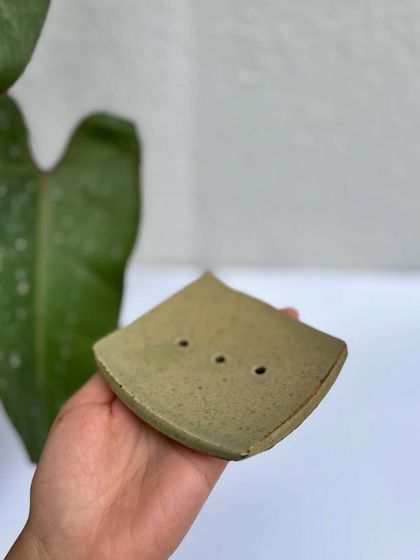 A side view of the Green Celadon soap dish, showing its gentle curve.
