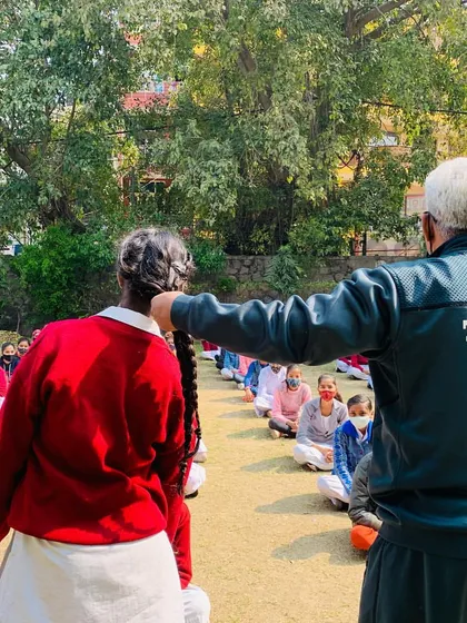 We practice defenses against common types of assaults to build real-world readiness. In this part of the workshop, I am showing a student how to defend against a hair-pull attack, a technique specifically useful for girls' self-defense.