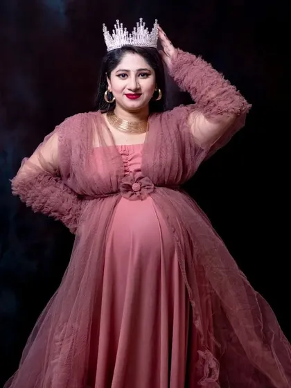 Every mother is a queen. Adding a crown as a prop in the studio elevates the portrait, making you feel as regal and powerful as you are.
