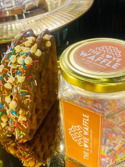 This waffle, with its colorful sprinkles and chocolate chips, is a testament to the fun I like to bring to my dessert counters.