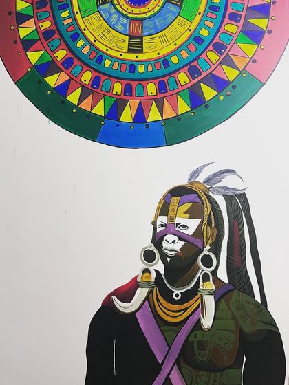 A close-up of the African warrior and mandala mural. The vibrant colors and bold design create a powerful and artistic atmosphere for the tattoo studio.