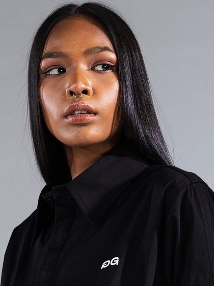 A profile shot highlighting the sharp, clean lines of the makeup. We used a subtle winged liner and a neutral lip to complement the model's features and the modern styling.