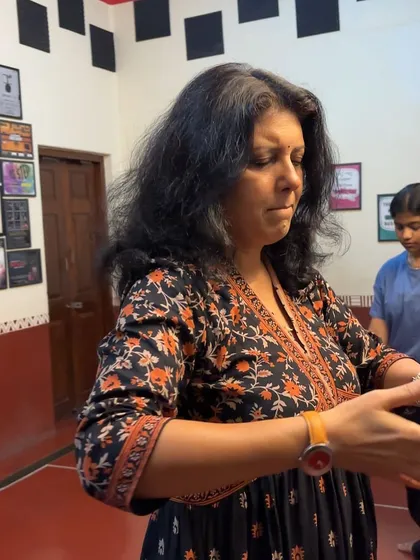 A participant in our movement workshop engages in a mindfulness exercise. Our 'Body Works' program focuses on the mind-body connection as a source of creative expression.