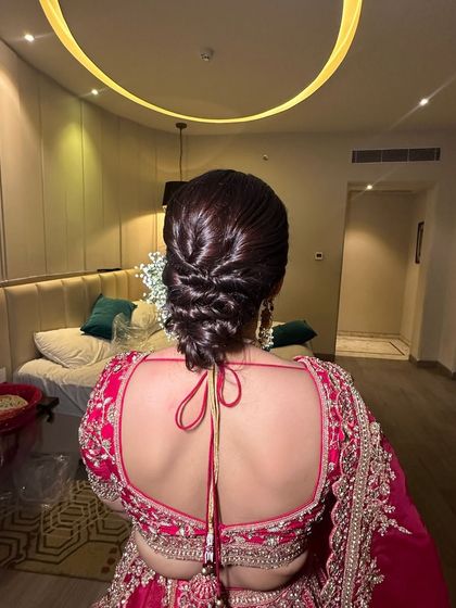 Another angle of the woven messy bun, highlighting the clean lines and texture. This style is perfect for a bride who wants a modern yet elegant look for her wedding day.