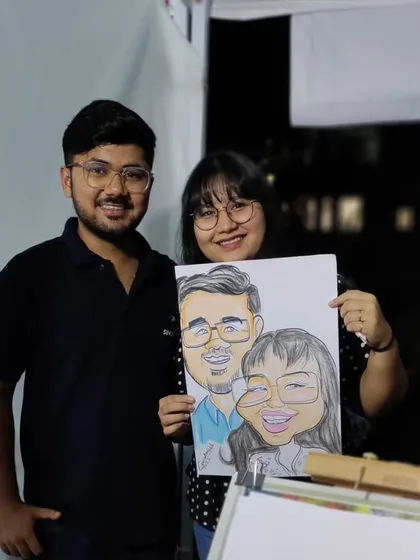 A perfect keepsake for a lovely couple. I enjoy drawing couples and capturing their connection in a fun, cartoon style. This one was done live at a night carnival, and their smiles say it all.